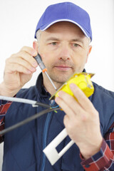 electrical installer working in an electrical box