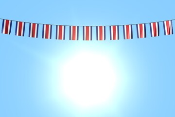 beautiful holiday flag 3d illustration. - many Costa Rica flags or banners hanging on string on blue sky background