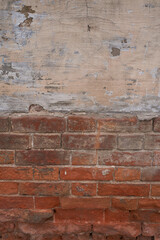Old brick wall, old texture of red stone blocks closeup