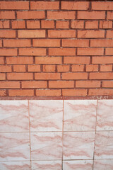 Old brick wall, old texture of red stone blocks closeup