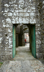 Fototapeta premium double entrance to the castle of Vimianzo with first wooden door and second ones made of iron bars
