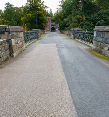 bridge at Penrhyn dock leads to a gatehouse for Penrhyn castle, Bangor Wales UK 