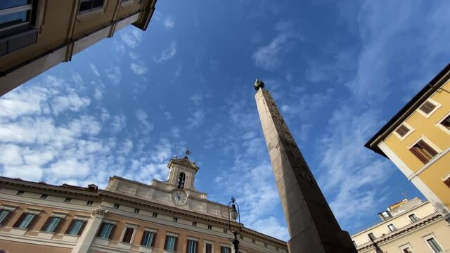 Facade of the Montecitorio Palace in Rome, seat of the Italian Chamber of Deputies in a sunny day. Italian Parliament. Democracy and politics