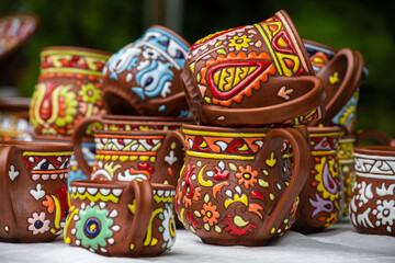 Fototapeta na wymiar Traditional homemade ceramic pots on traditional crafts fair