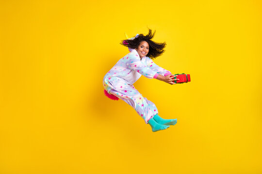 Full body profile side photo of young black woman happy positive smile give present isolated over yellow color background