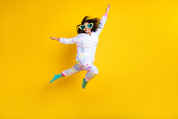 Full length photo of young black woman happy positive smile jumper hipster glasses isolated over yellow color background