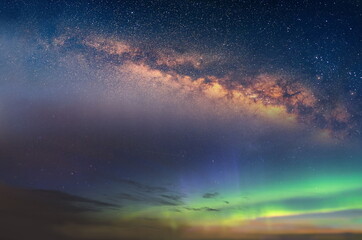 starry night blue sky nebula  on pink sunset Aurora borealis milky way dramatic clouds cosmic space...