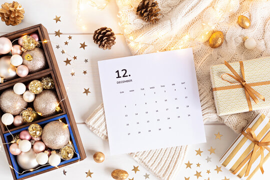 Christmas background with calendar for December and xmas decoration. Winter holidays celebration concept. Flat lay, top view