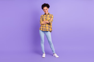 Fototapeta premium Full length photo of young attractive african girl happy positive smile crossed hands isolated over purple color background