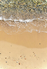 Play of light between pebbles and sea in the bay of Ajaccio.