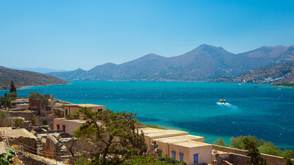 the blue sea of Greece against the background of mountains in sunny weather