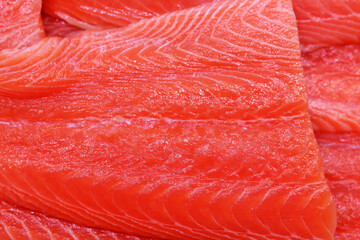 Salmon fish texture close up. Beautiful pink texture of fresh fish. Healthy eating concept. 