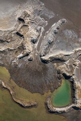 Drone view of the turquoise lake formed as a result of mining waste