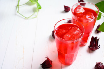 Roselle juice on wooden background, herbal organic tea for good healthy