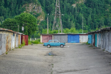 Russian car VAZ in the middle of a garage cooperative