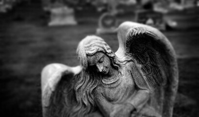 Gravestone Grave Stone in Cemetery Angel Statue Wings and Prayer