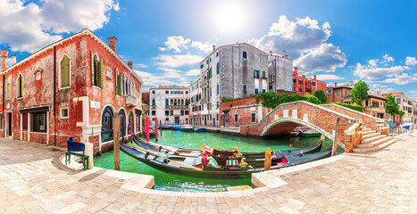 Gondolas moored in the Grand Canal by the bridge, Venice, Italy