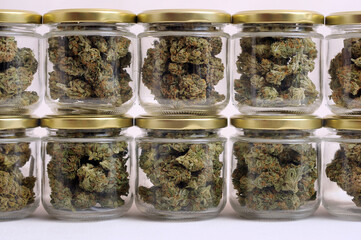 Cannabis drying and curing. Marijuana buds in glass jars. Eco container. Hemp growing concept.