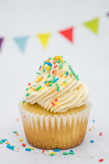 cupcake with sprinkles on a marble background