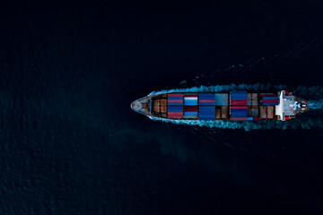 containers ship corgo logistic transportation sailing top speed in dark sea Photograph aerial top...