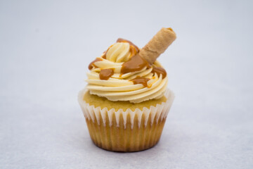 caramelised milk cupcake on a marble background