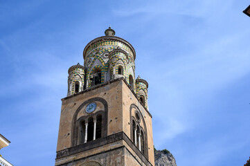 Fototapeta premium amalfi bell tower Cathedral of Sant'Andrea front of the religious facade close up - amalfi coast italy tourism