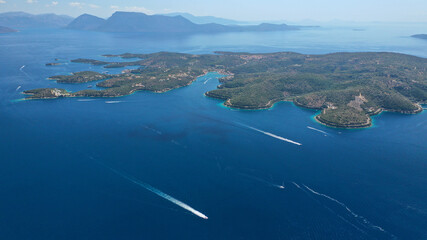 Obraz premium Aerial drone photo of safe anchorage of fjord bays in Meganisi island with crystal clear calm sea, Meganisi island, Ionian, Greece