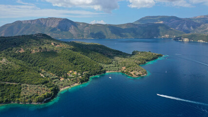 Fototapeta na wymiar Aerial drone photo of fjord looking paradise bays in island of Meganisi a true sail boat and yacht calm sea anchorage protected by winds, Ionian, Greece