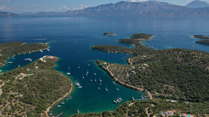 Aerial drone photo of safe anchorage of fjord bays in Meganisi island with crystal clear calm sea, Meganisi island, Ionian, Greece