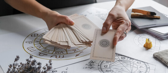 Astrology. Astrologer calculates  natal chart and makes a forecast of fate.Tarot cards, Fortune telling on tarot cards magic crystal, occultism, Esoteric background. Fortune telling,tarot predictions. - obrazy, fototapety, plakaty