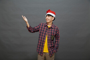 Portrait young asian man wear santa hat