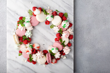 Christmas dessert wreath with macarons and meringues