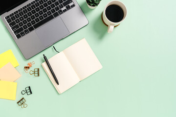Creative flat lay photo of workspace desk. Top view office desk with laptop, coffee cup and open...