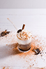 Milkshake drink with chocolate pieces and oreo cookies