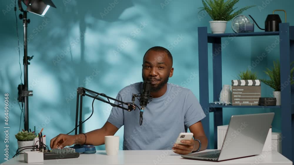 Poster pov of influencer filming podcast for vlog channel in studio. social media vlogger talking to subscr