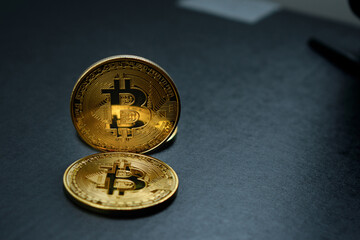 bitcoin crypto currency in gold color on black background