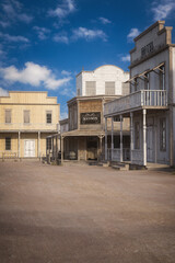 Portrait format photo realistic 3D rendering of a wild west town street with copy space.