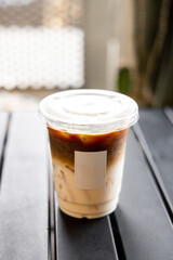 iced coffee milk latte on black table.vertical image