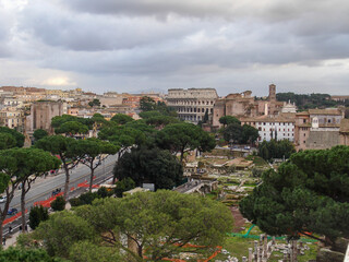 Fototapeta na wymiar Top view of Roman Forum at Rome with Coliseum in the background