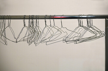 deserted cloackroom clothes rack in convention center