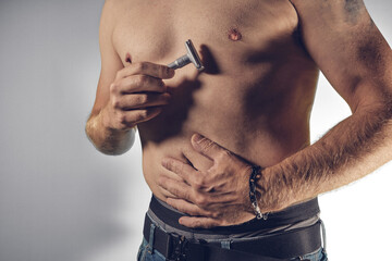 Shaving the male breast with razor plane