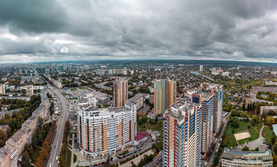 Multistory modern high buildings cityscape aerial view. Kharkiv city Pavlovo Pole district panorama, Nauky ave with epic dark clouds