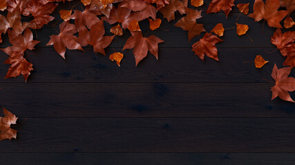 Top down view of Dark wood Tabletop with leaves.