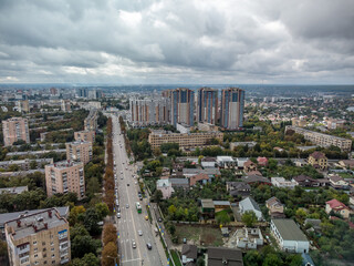 Cityscape aerial with dramatic clouds. Kharkiv city Pavlovo Pole district, view on Nauky ave with multistory modern high residential buildings