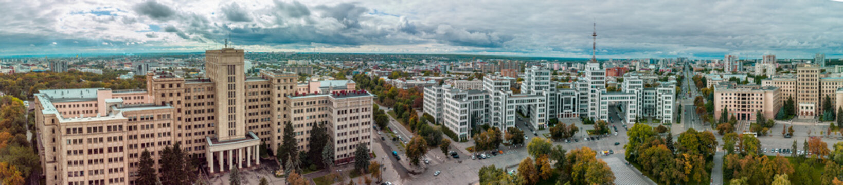 Autumn colorful city aerial panorama view from Freedom Svobody Square on Derzhprom and Karazin National University buildings with epic cloudscape in Kharkiv, Ukraine