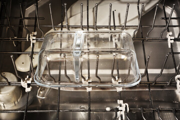Clean glass container in dishwasher