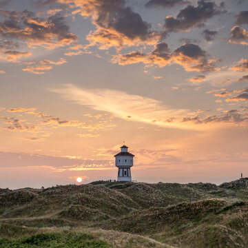 Sunrise at the water tower on Langeoog island, Lower Saxony, Germany