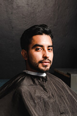 Portrait of a young adult in a barber shop