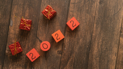christmas numbers 2022 on a wooden background with a place for text , a Christmas banner