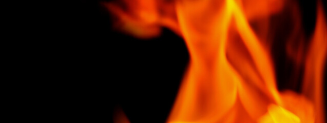 Fototapeta premium Fire background. Abstract burning flame and black background. represents the power of burning refers to heat spicy seductive sensual or burning fuels. fire incidents burning destroys everything.